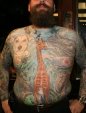 Red Rocket tattoo tattooed man